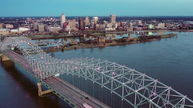 Aerial Reverse Fly Out of Downtown Memphis over the Hernando de Soto Bridge at Dusk