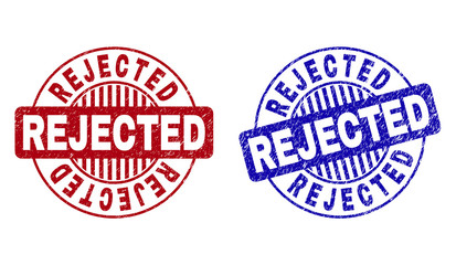 Grunge REJECTED round watermarks isolated on a white background. Round seals with grunge texture in red and blue colors. Vector rubber watermark of REJECTED text inside circle form with stripes.