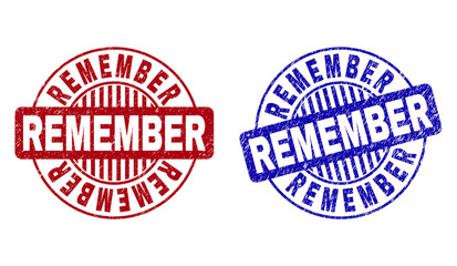 Grunge REMEMBER round stamp seals isolated on a white background. Round seals with grunge texture in red and blue colors. Vector rubber watermark of REMEMBER text inside circle form with stripes.