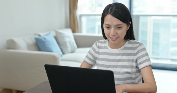 Woman watch on computer at home