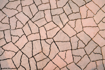 Beautiful seamless pattern of orange and brown cobblestones.