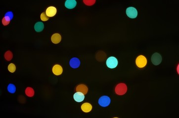defocused colored lights on black background