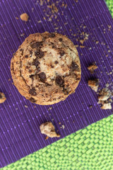 delicious chocolate chip cookie isolated on purple tablecloth