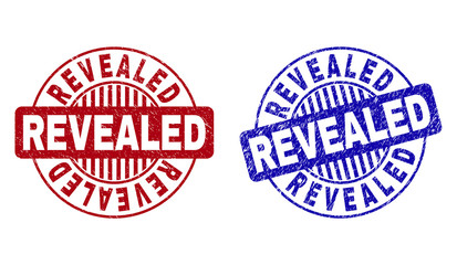 Grunge REVEALED round stamp seals isolated on a white background. Round seals with grunge texture in red and blue colors. Vector rubber imprint of REVEALED title inside circle form with stripes.