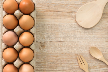 Eggs for cooking on wood background top view.Flat lay.