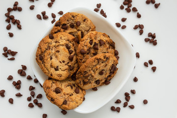 chocolate chip cookies watered on white plate