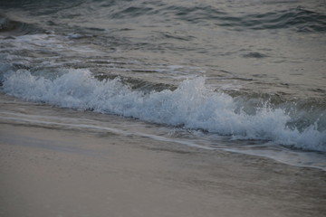 Bubble Foam of the Sea Wave on the Beach and Fine Sand,The Glittering from the Bubbles makes the Precious scenery of the Seashore , peaceful and Tranquility