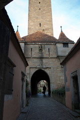 Fototapeta na wymiar Rothenburg ob der Tauber Germany, cobblestone street and Burgtor or castle gate