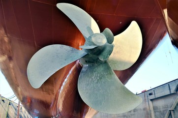 View of the propeller of cargo ship during dry dock maintenance. 