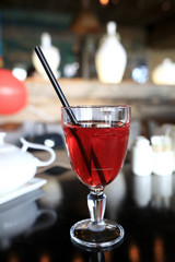 Glass of juice with straw