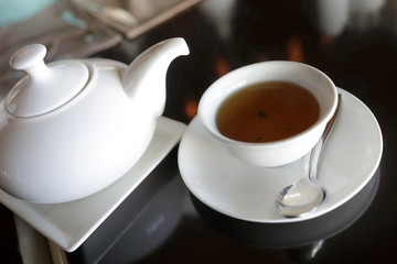 Teapot and teacup with tea