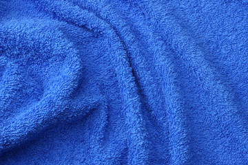 Fototapeta na wymiar Blue beach towel texture. Blue beach towel background. Top view.