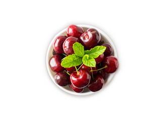 Fresh red cherries isolated on white background. Cherries in a bowl on white. Cherry fruit with copy space for text. Ripe cherry on a white background. Various fresh summer fruits. Top view. 