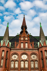 Fototapeta na wymiar Tower on an old church under blue sky in germany