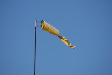 windsock against blue sky