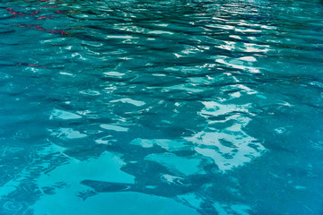 Fototapeta na wymiar The blue clean water swimming pool