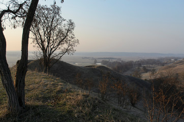 Landscape beautiful sunset in the mountains in the foreground dirt road