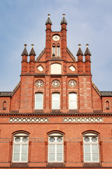 Fototapeta premium Facade of an old house with red bricks