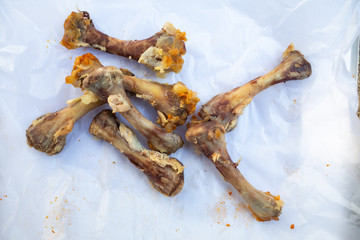 Fototapeta premium Seven Chicken Bones in Leg with white facial papers in the box, Abstract background