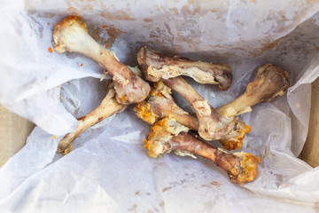 Seven Chicken Bones in Leg with white facial papers in  the box, Abstract background