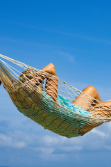 Woman on a hammock at the beach