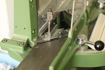 the guillotine for the production of frames for paintings, photographs
