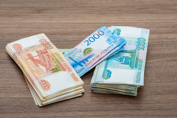 paper banknotes of two hundred rubles one thousand, two and five thousand rubles of the Russian Federation