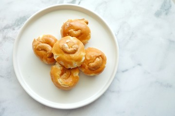 Close up of Singapore cookie on white plate.