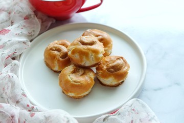 Close up of Singapore cookie on white plate.