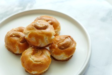 Close up of Singapore cookie on white plate.