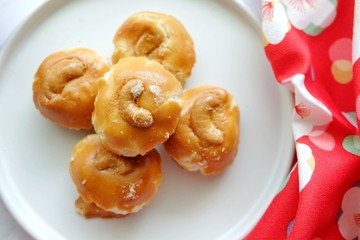 Close up of Singapore cookie on white plate.