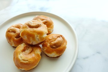 Close up of Singapore cookie on white plate.