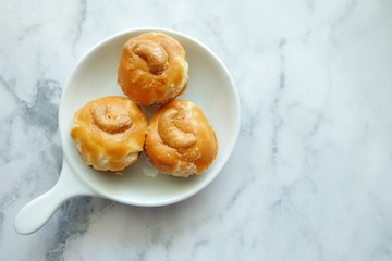 Close up of Singapore cookie on white plate.