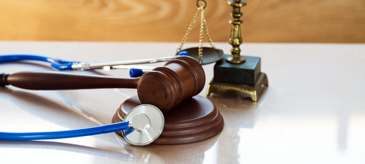 Law and Justice concept. Gavel and stethoscope