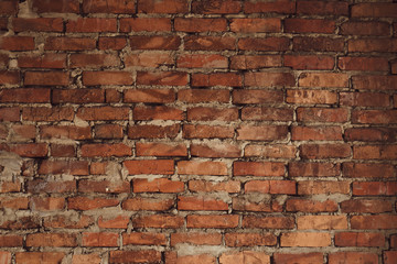 Old red brick wall background texture. Retro pattern with old red brick wall. Grunge background. Space texture. Brown retro rough texture. Urban street texture. Home interior decor. 