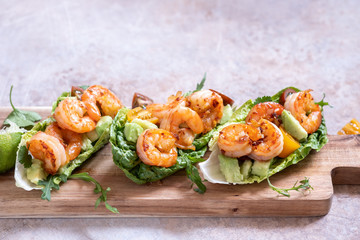 Lettuce wrapped Shrimp tacos with fresh tomato and avocado
