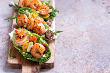 Lettuce wrapped Shrimp tacos with fresh tomato and avocado