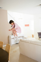 Girl jumping at home