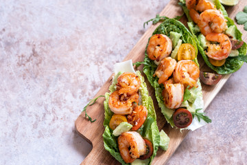 Lettuce wrapped Shrimp tacos with fresh tomato and avocado