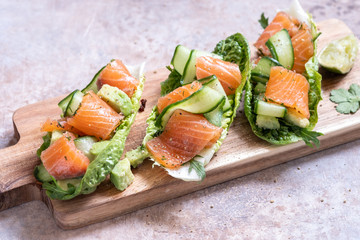 Lettuce wrapped smoked salmon tacos with fresh cucumber, avocado and eggs