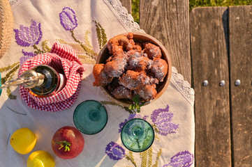 Picnic in the park in spring, with homemade pastries and wine. Good day for family and relaxation. Copy space.