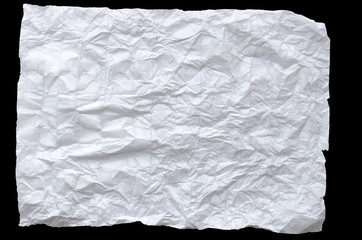 A CRUMPLED PIECE OF PAPER ON A BLACK BACKGROUND
