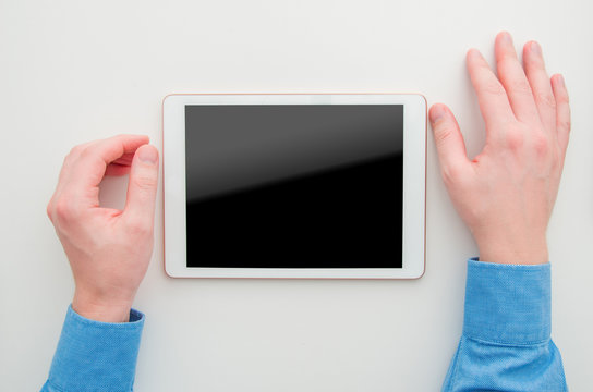 Mockup Image Of A Bussines Man Holding White Tablet Pc With Blank Black Screen. Top View