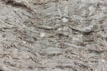 Texture of natural corrugated with grooves and cracks of granite stone