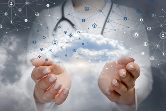 A doctor holding an information and data cloud.