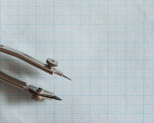 Set of drawing instrument and rulers on graph paper