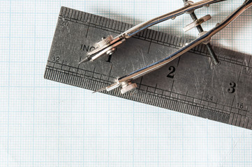 Set of drawing instrument and rulers on graph paper