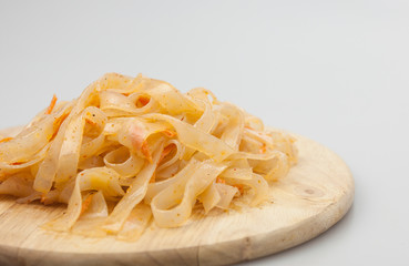Funchoza salad with rice noodles on white. Copy space