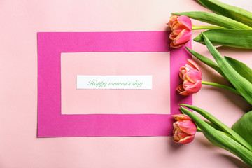 Text HAPPY WOMEN'S DAY with beautiful flowers on color background