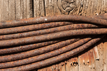 Old sling rusty knot with wood, selective focus